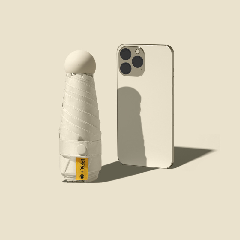 Sombrilla compacta plegable protección contra rayos UV