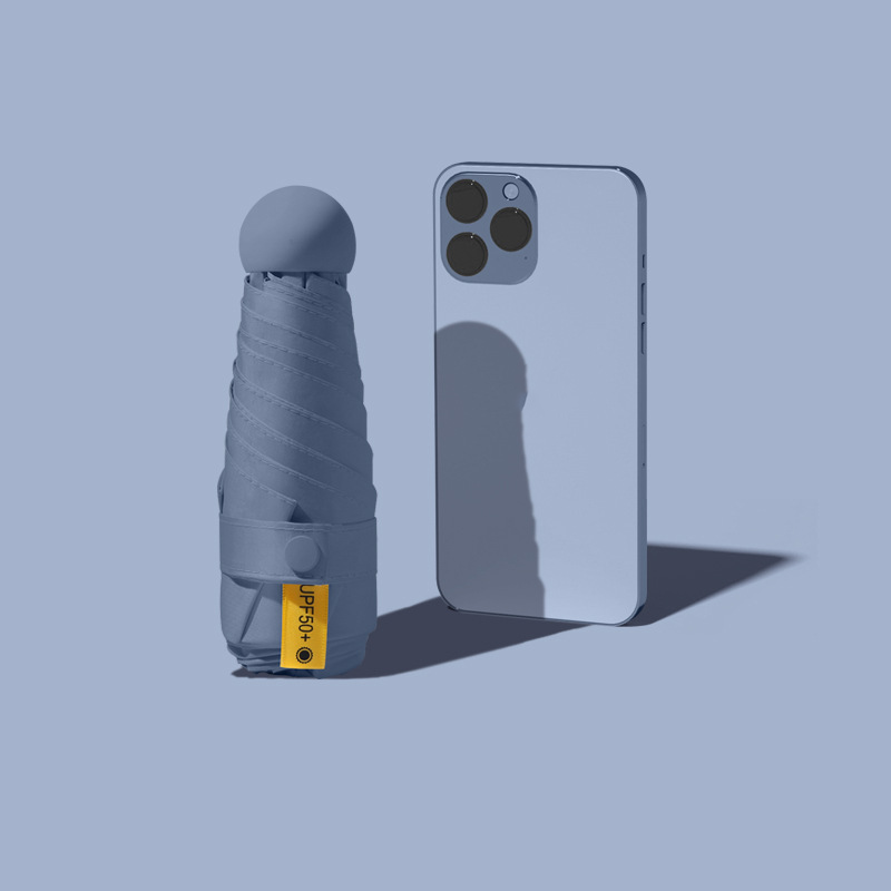 Sombrilla compacta plegable protección contra rayos UV